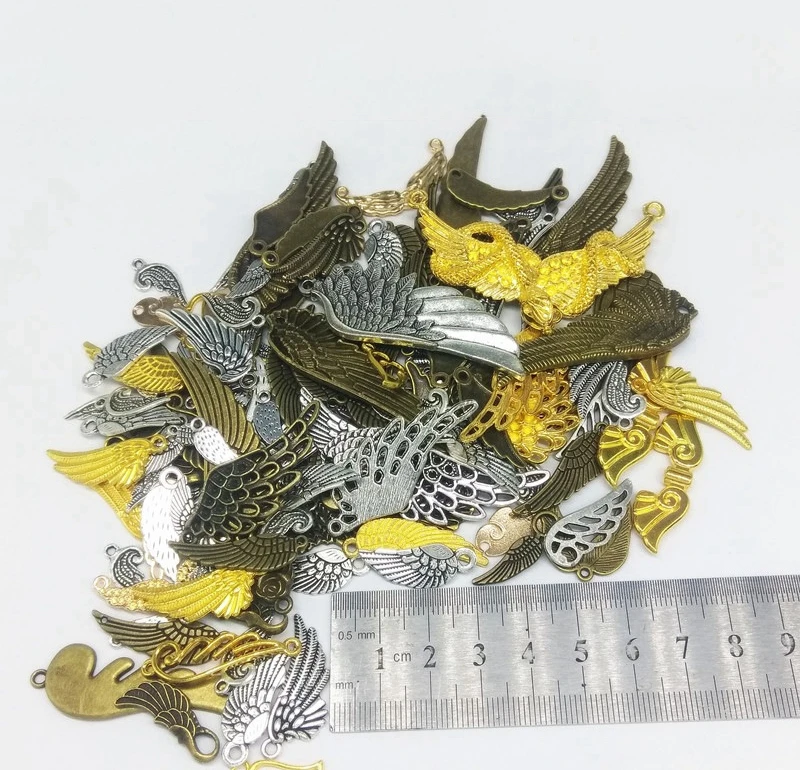 100 граммов в упаковке смешанпосылка из сплава виде крыльев и перьев для легких