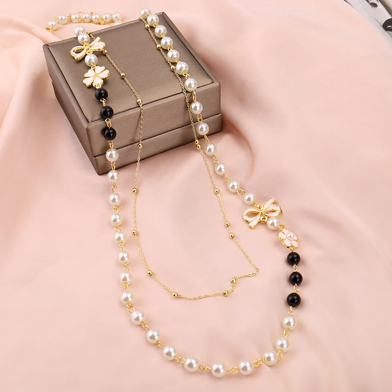 Колье многослойное женское с жемчугом длинное ожерелье камелией и бантом модная