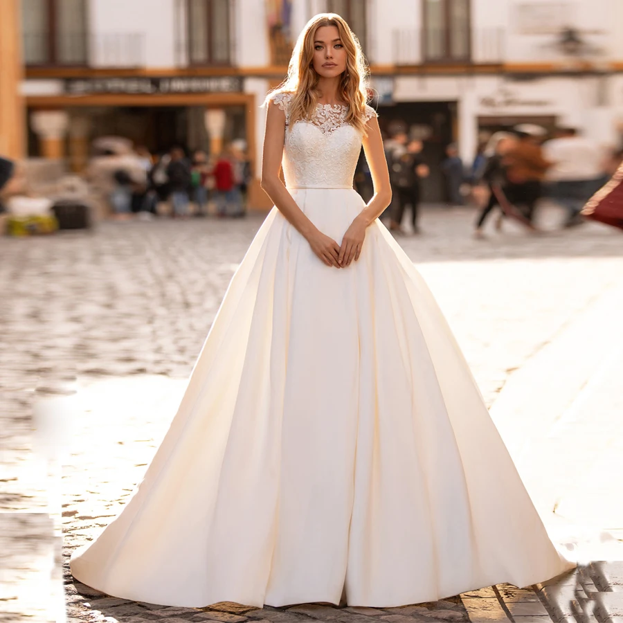 

Sexy Satin Ball Gown Wedding Dresses Cap Sleeve Lace Applique Sweep Train Bridal Gown Illusion Back Abiti Da Sposa Wedding Dress