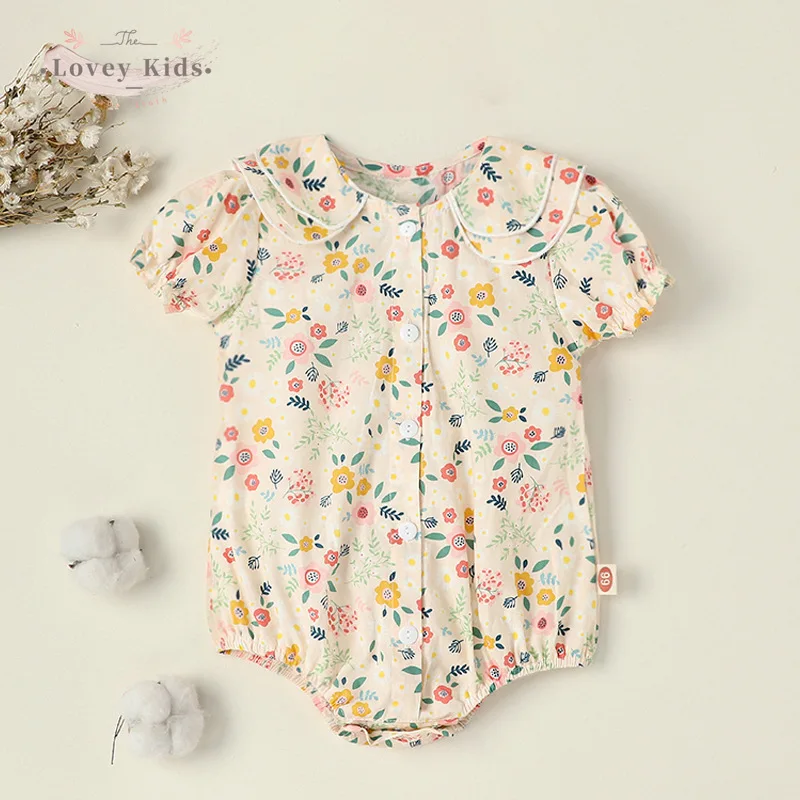 

Детское боди с коротким рукавом, круглым вырезом и цветочным принтом