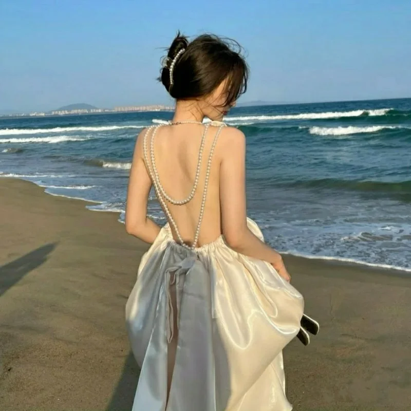 

2021 New Pearl Open Back Bow Tie Dress Temperament Banquet Travel Dress Skirt Round Neck Knee-length Skirt S-XL Woman Dress