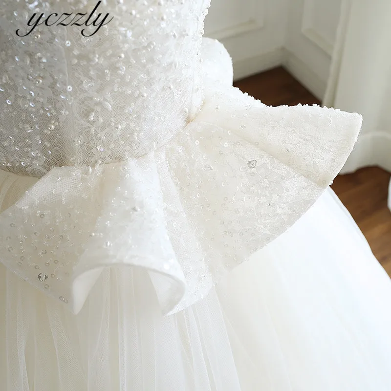 Роскошное бальное платье на тонких бретельках кружевное свадебное с жемчугом и