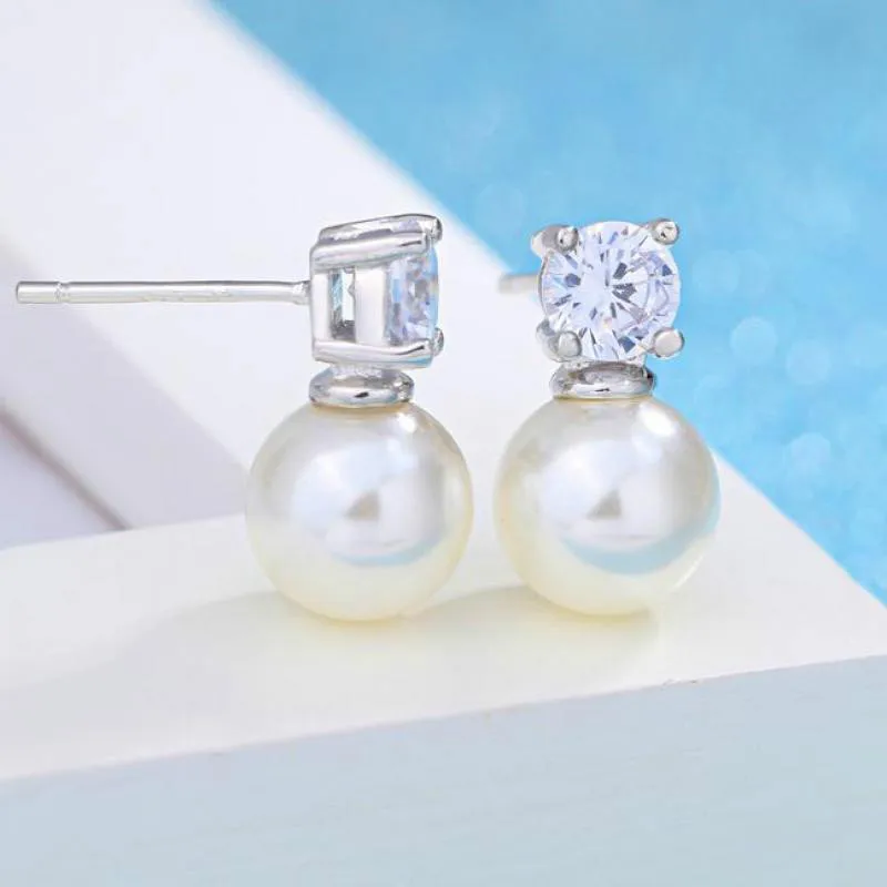 Серьги-гвоздики женские серебряного цвета с жемчугом и цирконом - купить по