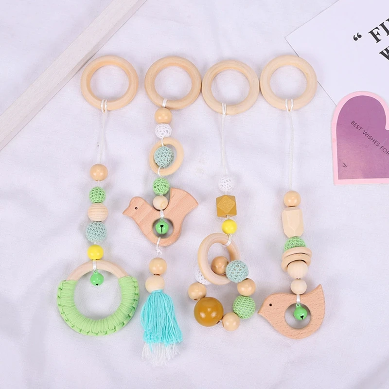 

4 Pcs/Set Baby Gym Frame Stroller Hanging Pendants Wooden Ring Teether Molar Teething Nursing Rattle Toys Gifts Infant Room