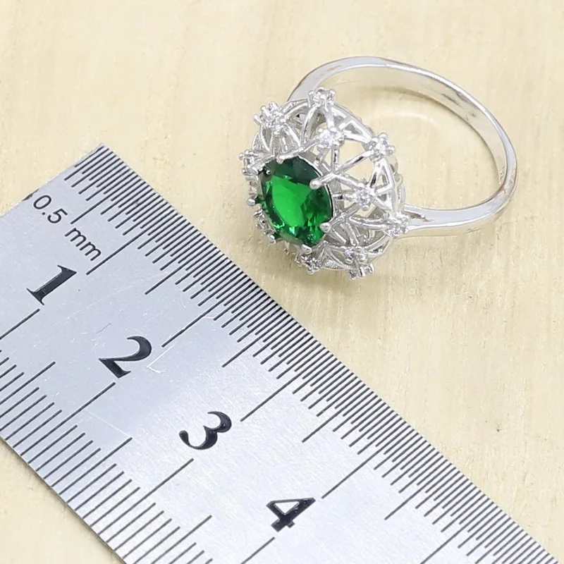 Женский ювелирный комплект из колье серёг и браслета серебристого