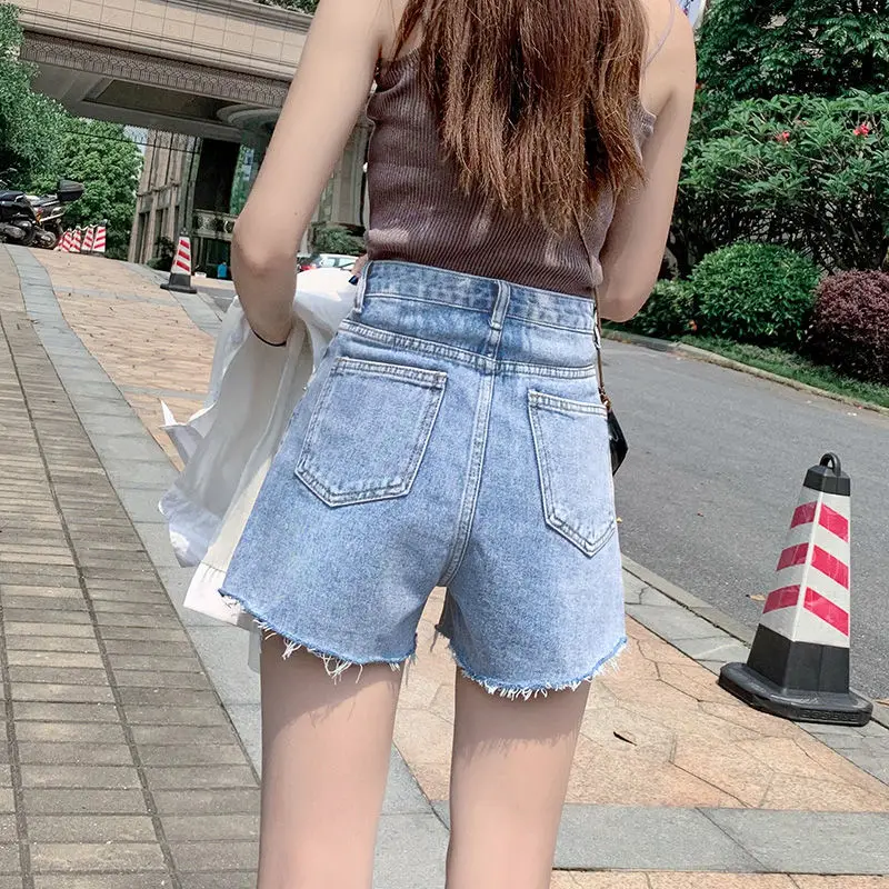 

Holed denim shorts women's 2021 new ins high waist slim loose versatile A-line pants with rough edge and wide leg hot pants