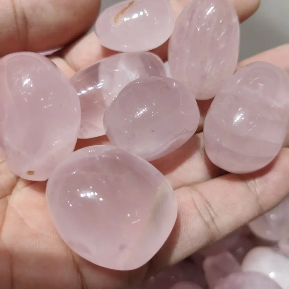 

Натуральный розовый кварцевый кристалл Кристалл Овальный гравий рейки с лечебным действием, образцы