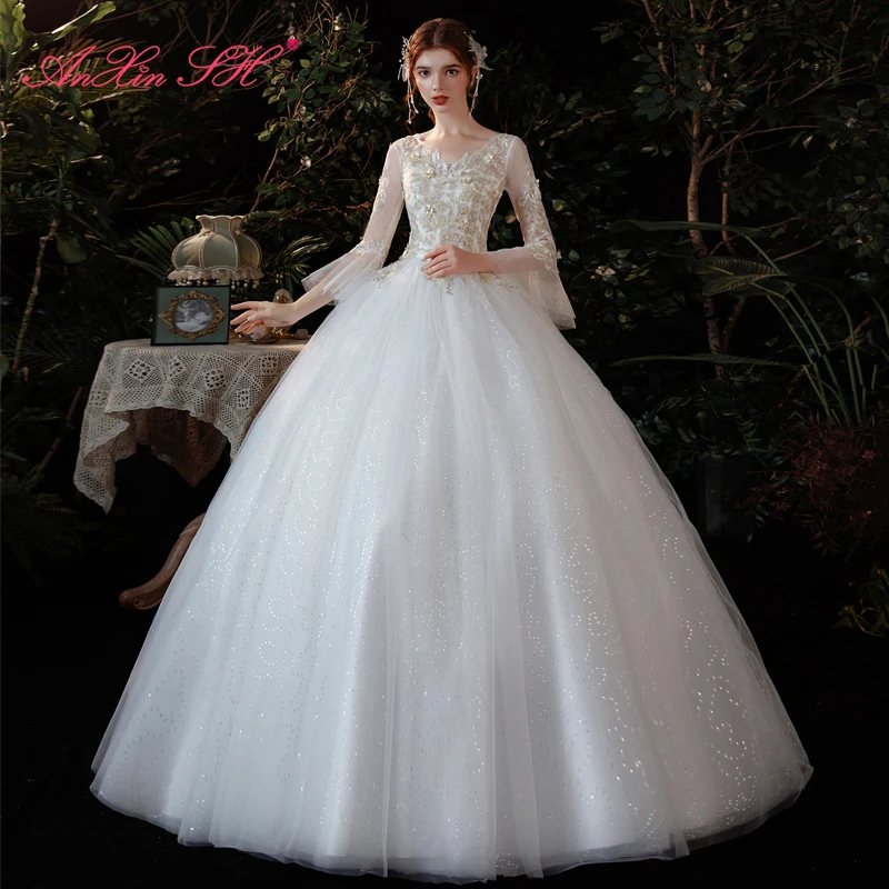

AnXin SH princess champagne flower white lace wedding dress vintage v neck beading illusion flare sleeve bride wedding dress