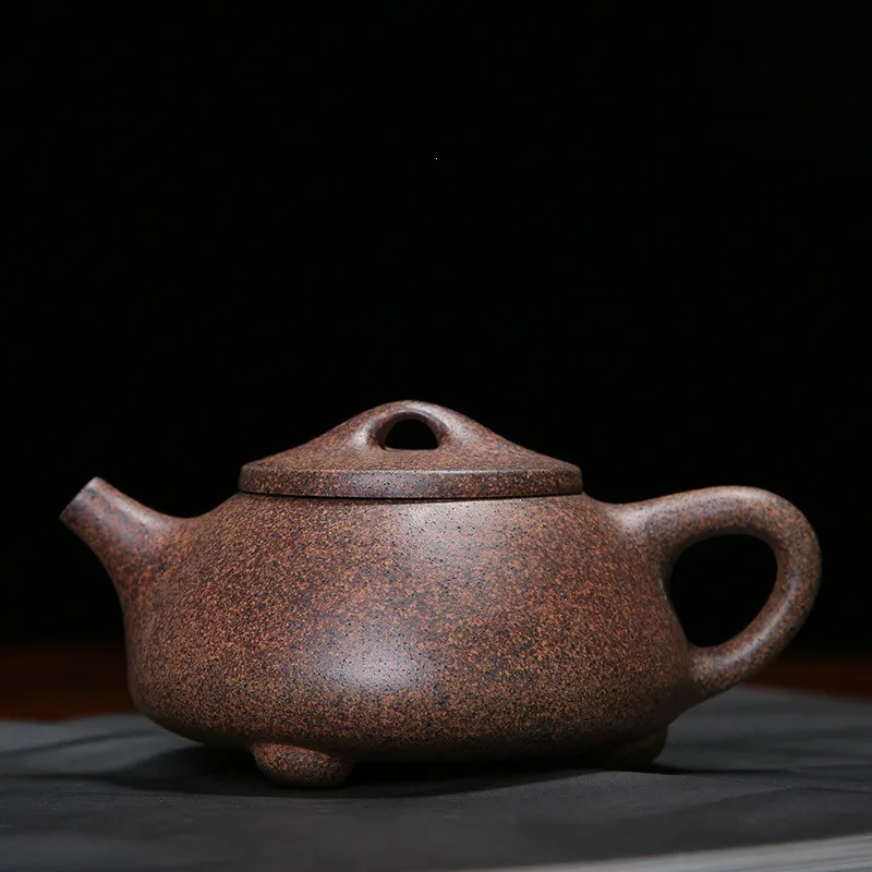 

Yixing famous modern retro personality purple clay teapot pure handmade raw ore purple mud kiln stone scoop teapot teapotLB80618