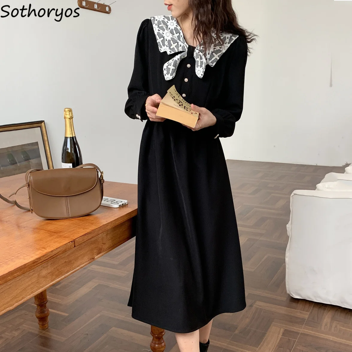 

Женское платье-миди с бантом на воротнике и длинным рукавом