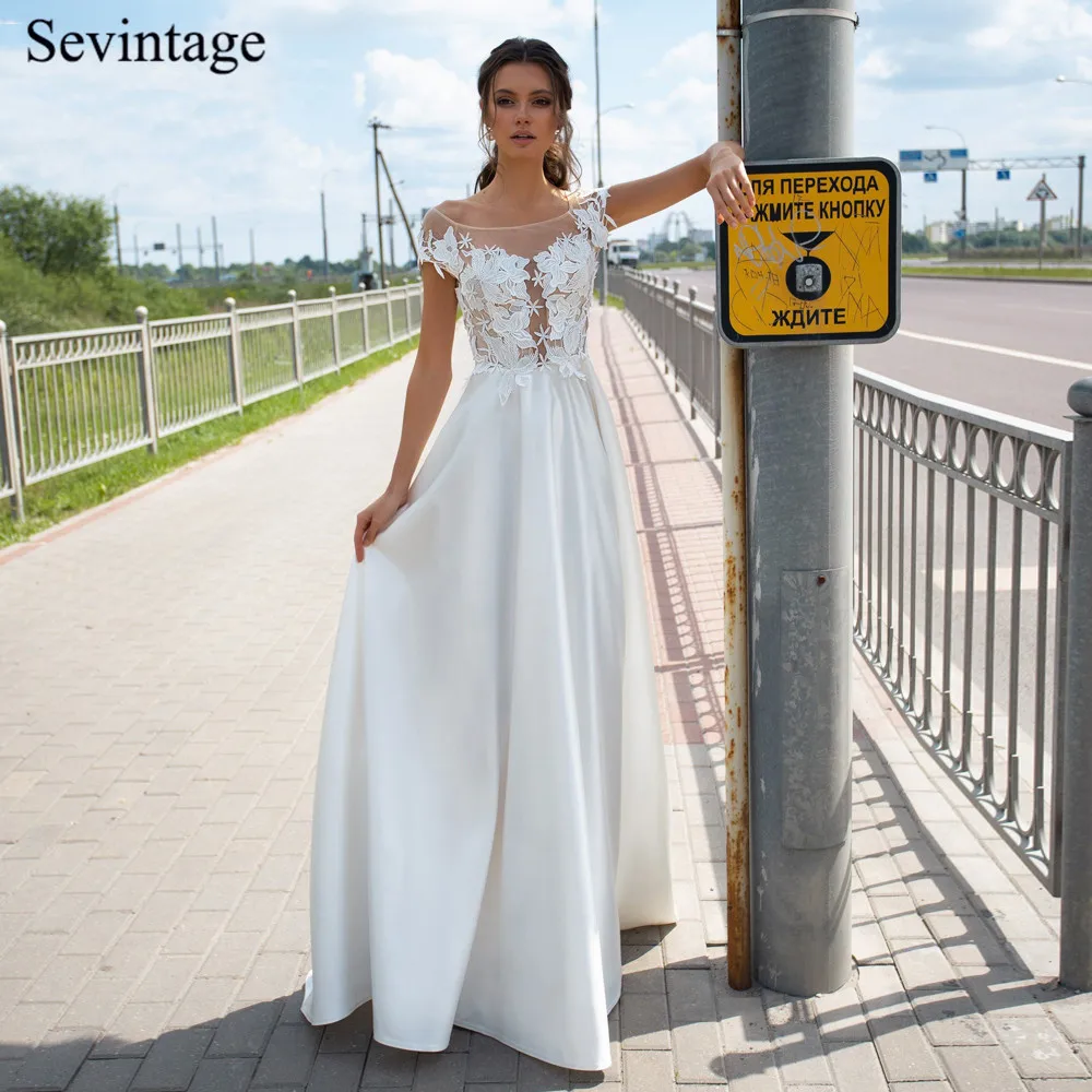 

Sevintage Princess Beach Boho Wedding Dresses Lace Cap Sleeve Tulle Satin Bridal Gowns Buttons Back Vestido De Noiva 2020