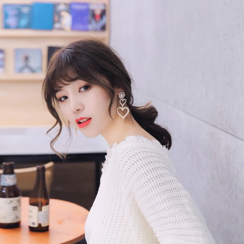 

Simple fashion personality wild pearl peach heart love earrings female temperament long sweet Korean earrings