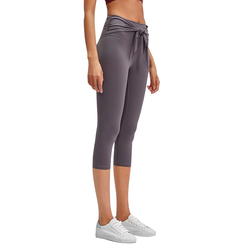 

Skin-friendly nude stretch slim yoga pants European and American front waist fashion lace cropped trousers