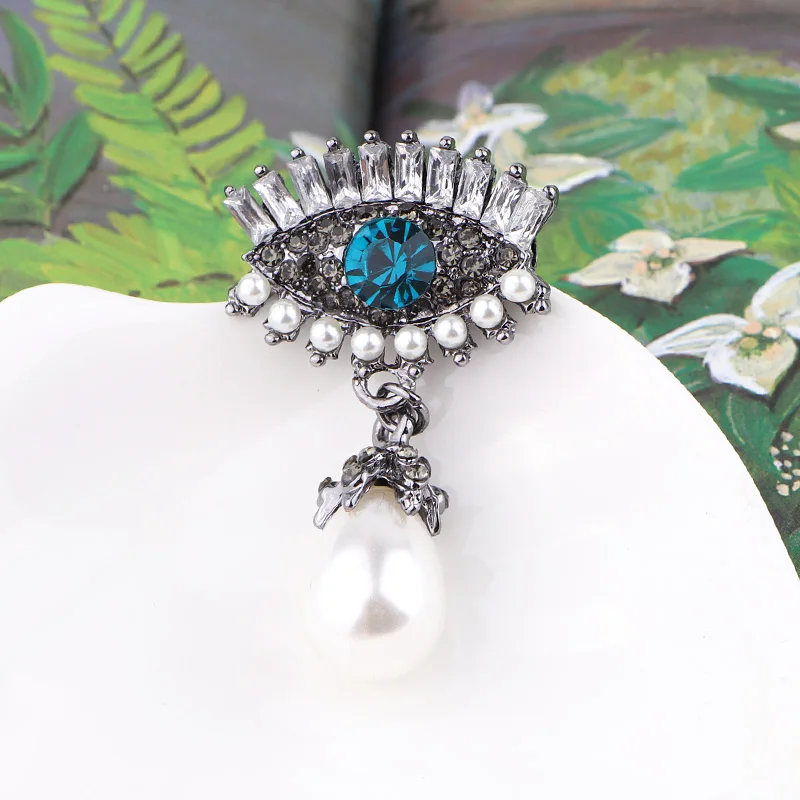 Женская брошка TODOX из сплава золота и цинка с кристаллами в виде птиц-пауков |