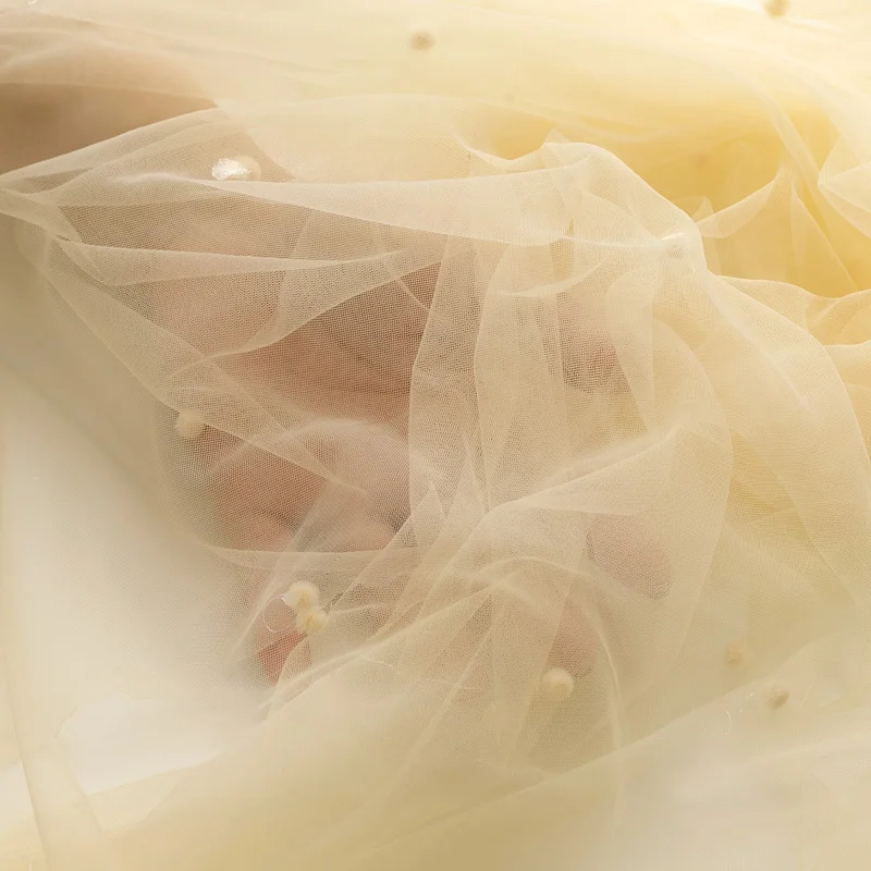 Марлевая ткань абрикосовая мягкая пряжа кружевная ручной работы фон свадебного