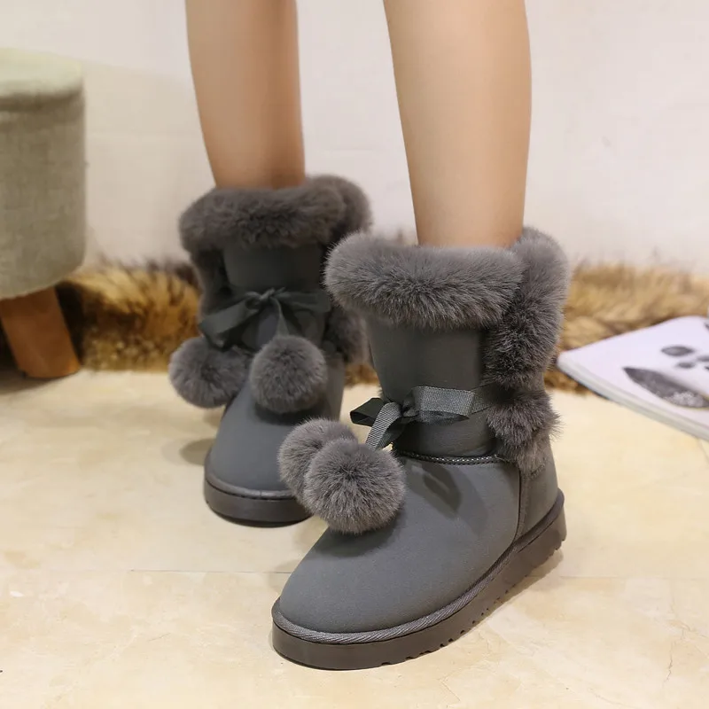

HOt Snow boots women's short tube Plush 2020 winter new fluffy ball short boots lace up students' versatile female ankle boots