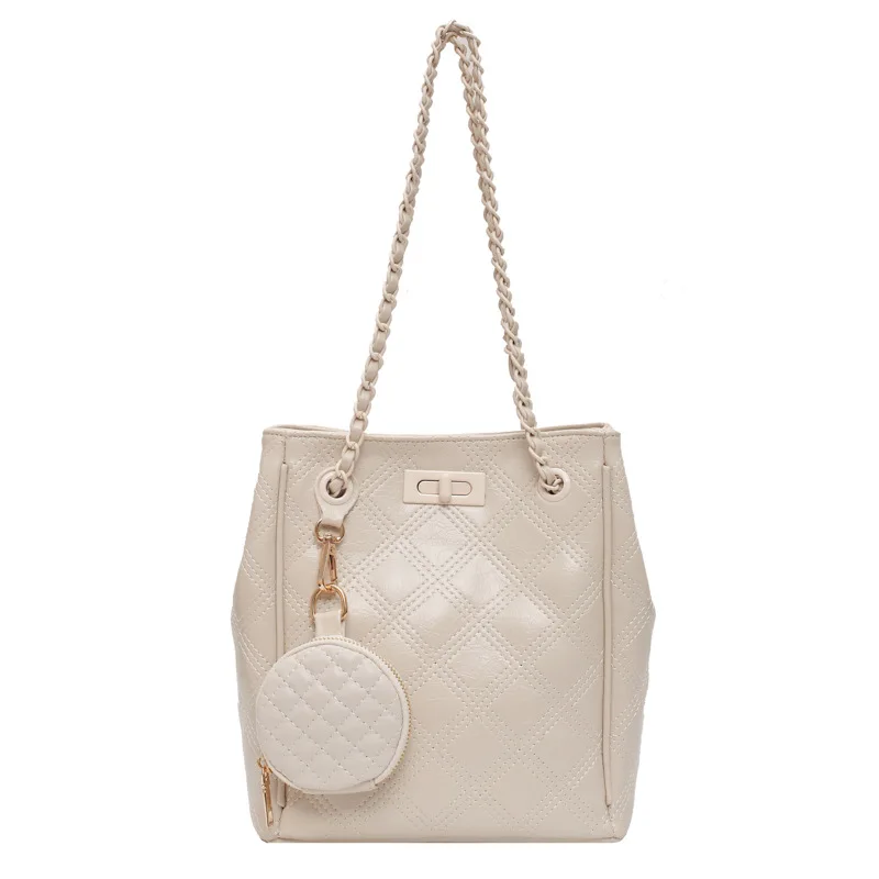 

Новая Корейская версия сумочки большой вместимости xin Xin-это простая сумка через плечо с цепочкой для звонков