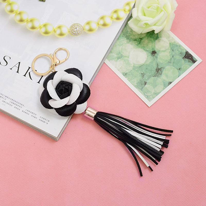 

2021 New 10 Colors Leather Rose Keychain DIY Handmade Jewelry Creative Lun Polyester Ice Silk Tassel Ear Bag Pendant