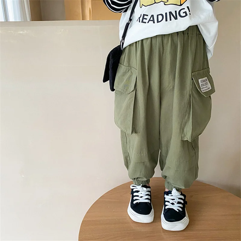 

Korean style boys big pockets cargo pants 2021 autumn Left side label loose casual trousers