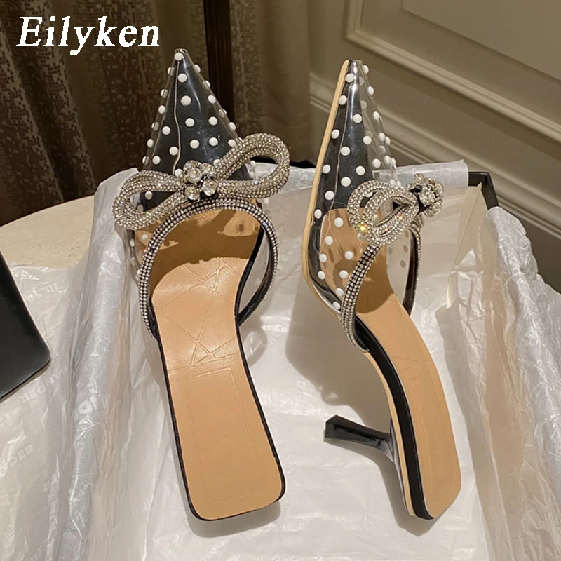 

Eilyken Summer PVC Transparent Pearl Mules Slippers Ladies Pointed Toe Strange Style Crystal Bowknot Women Casual Shoes