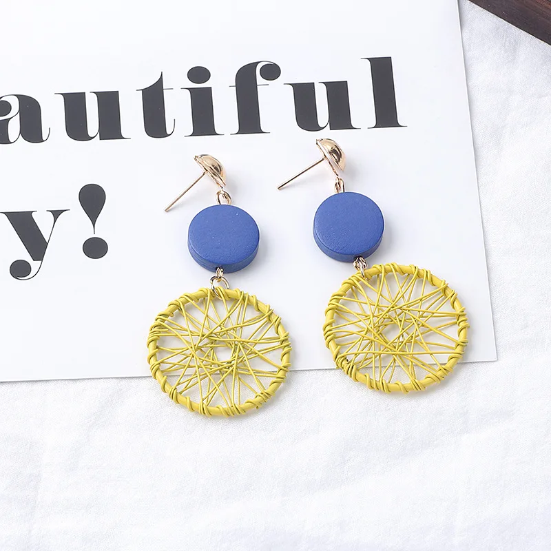 

Japan And South Korea New Temperament Long Wooden Tassel Earrings Retro Creative Hollow Geometric Winding Dream Net