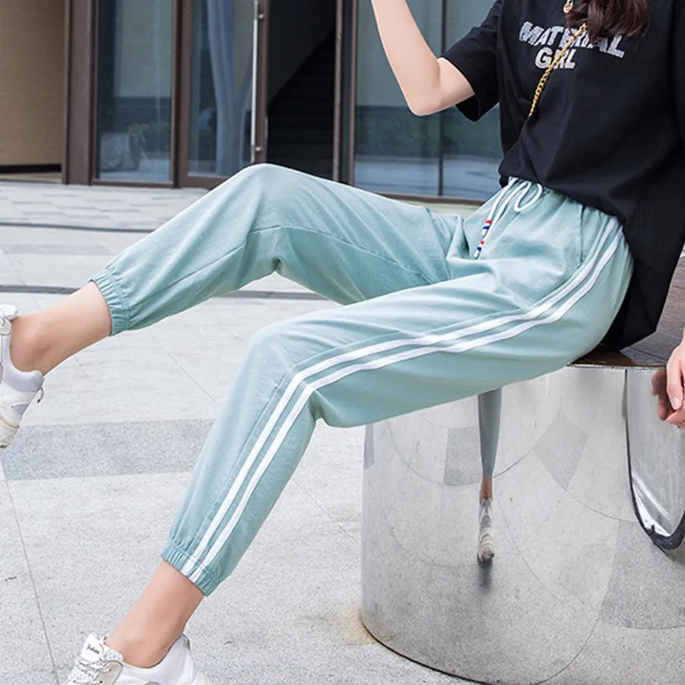 Штаны спортивные женские свободные с полосками по бокам размера плюс | Женская