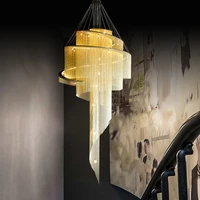 post modern duplex building large chandelier empty living room villa golden tassel spiral staircase light