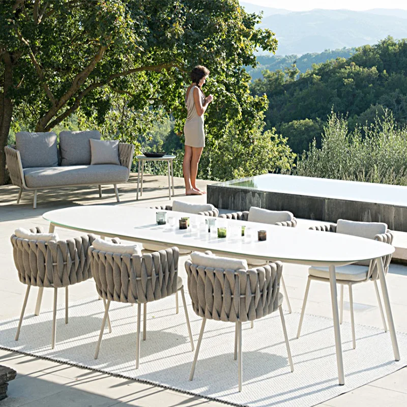 

Скандинавский уличный стол и стул, креативный ротанговый дизайнерский стол для загара и стул, ротанговый стул, плетеный стул из трех частей ...