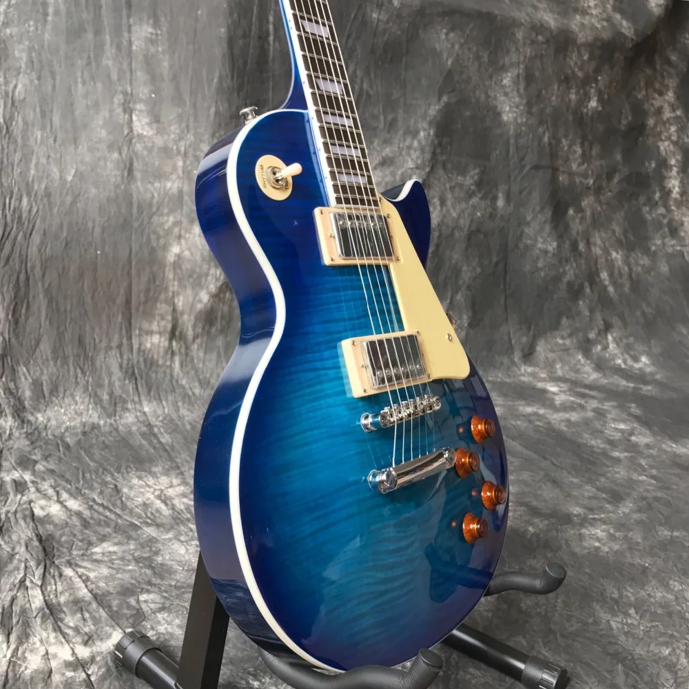 

Custom shop,blue color Tiger Flame standard electric guitar.mahogany body 6 stings guitarra. Rosewood fingerboard