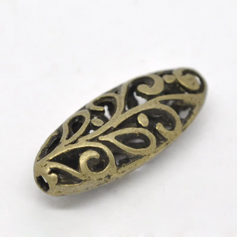 

DoreenBeads Zinc alloy Spacer Beads Oval Antique Bronze Flower Hollowcolor DIY Jewelry About 23mmx9mm,Hole:Approx 1.2mm,2 Pieces