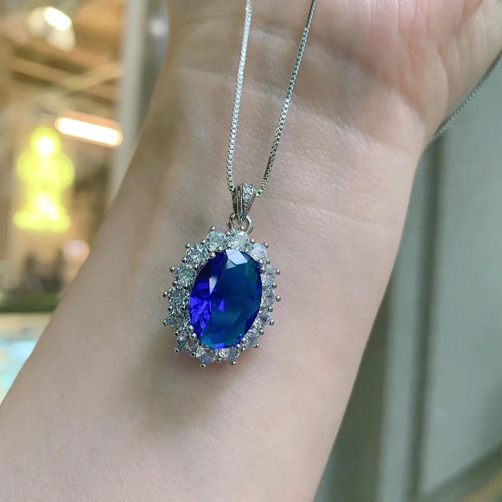 Комплект из кольца и серёг с танзанитом сапфиром