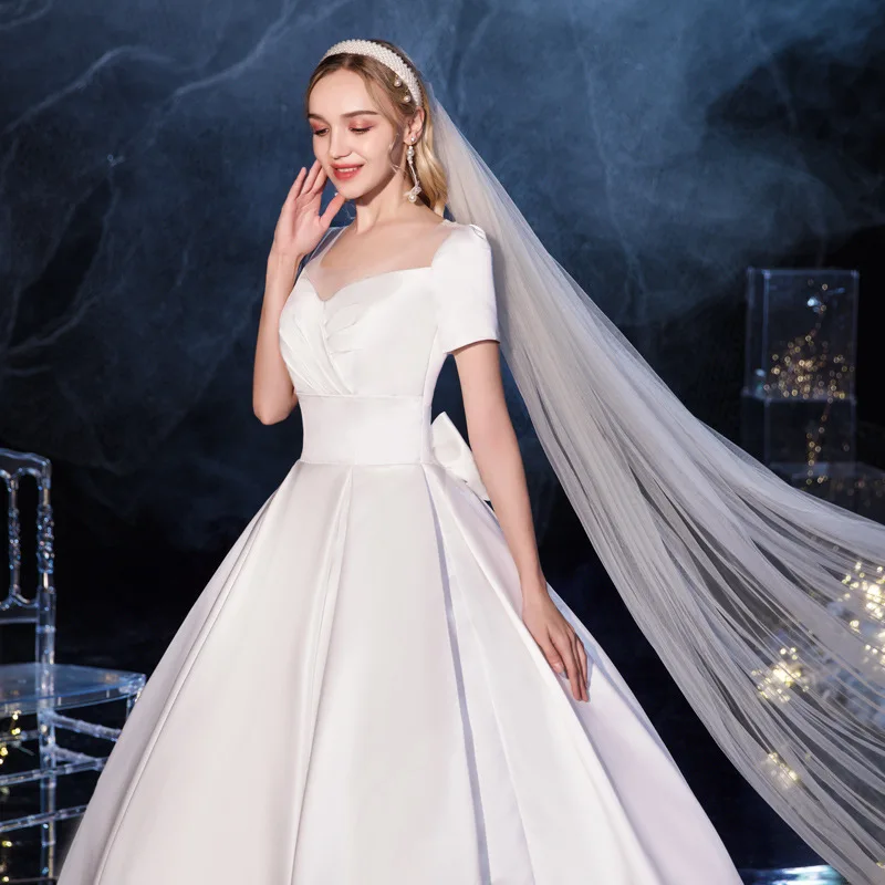 

Ball Gown Floor-Length White Satin Lace-up Bowknot Wedding Dress White Satin V-Neck Short Sleeves Glamorous Married Apparel
