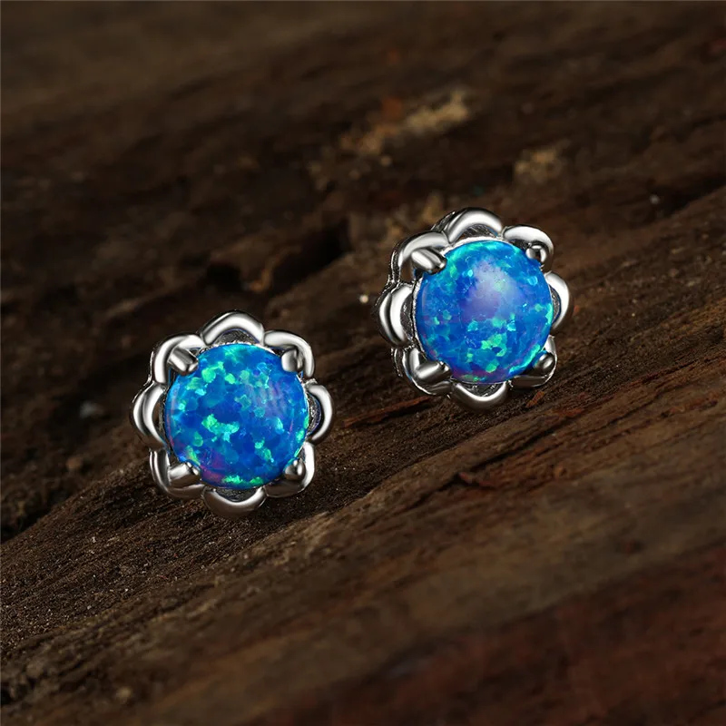 Серьги-гвоздики женские из розового золота и серебра с белым синим огненным