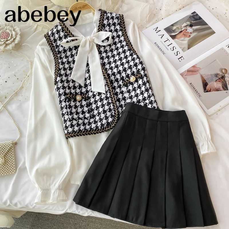 

Винтажный комплект из 3 предметов, рубашка с длинным рукавом и V-образным вырезом + жилет из твида + короткая плиссированная юбка с высокой та...