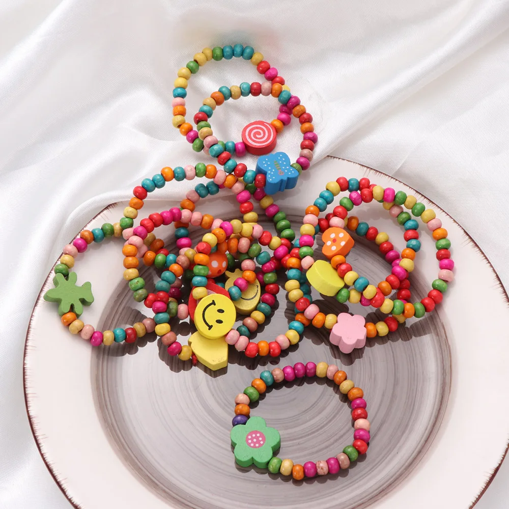 

12pcs Natural Wood Kids Elastic Wooden Beads Bracelets Children Girls Party Gift (Random Color)