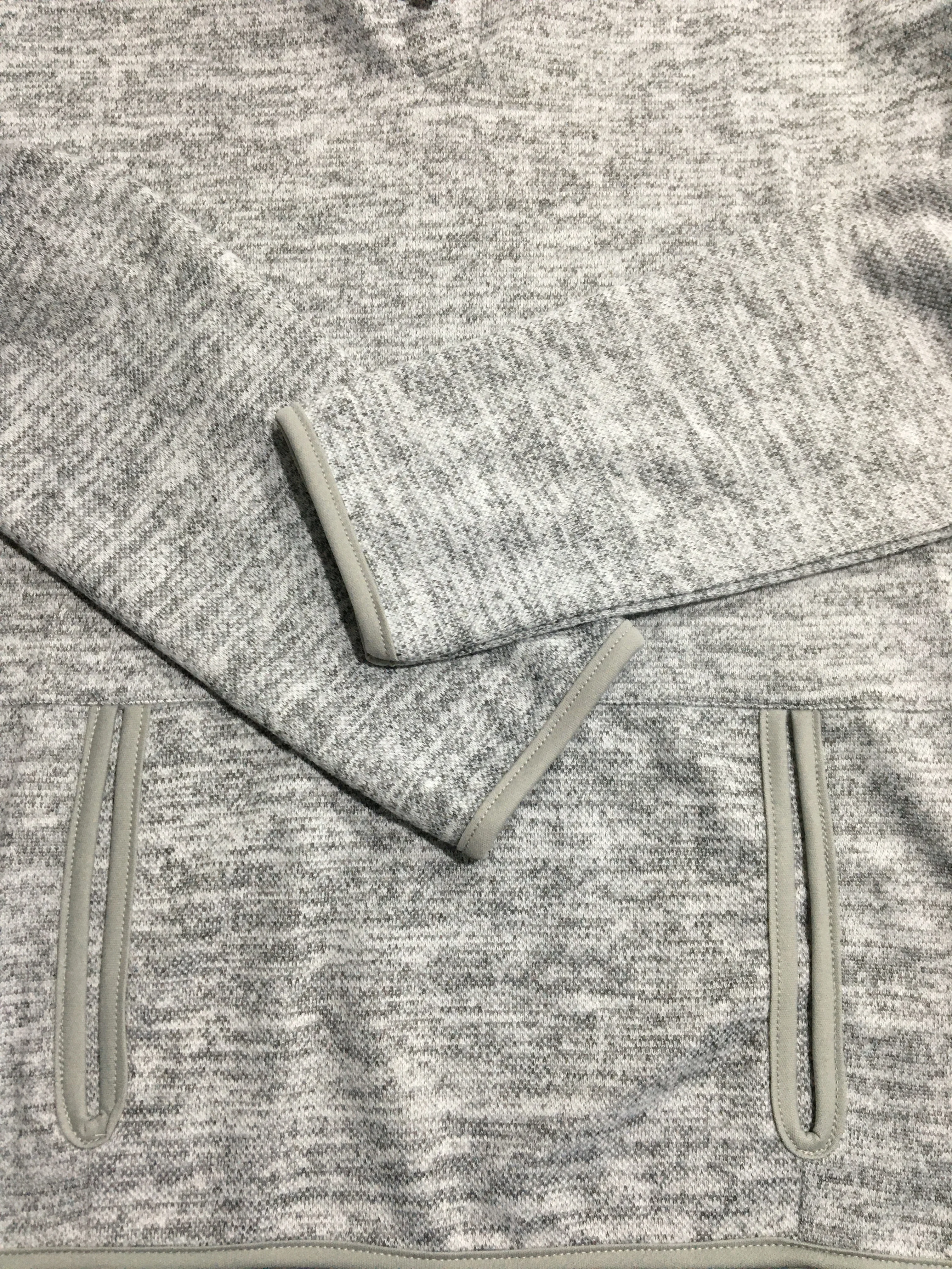 

A long-sleeved Hoodie with pock marks, and a piece of string, ladies