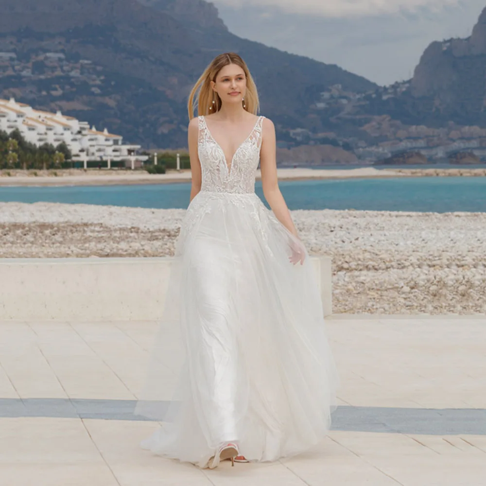 

Beach Sexy Deep V Neck A Line Wedding Dresses Spaghetti Straps Sleeveless Open Back Tulle Simple White Bridal Gown