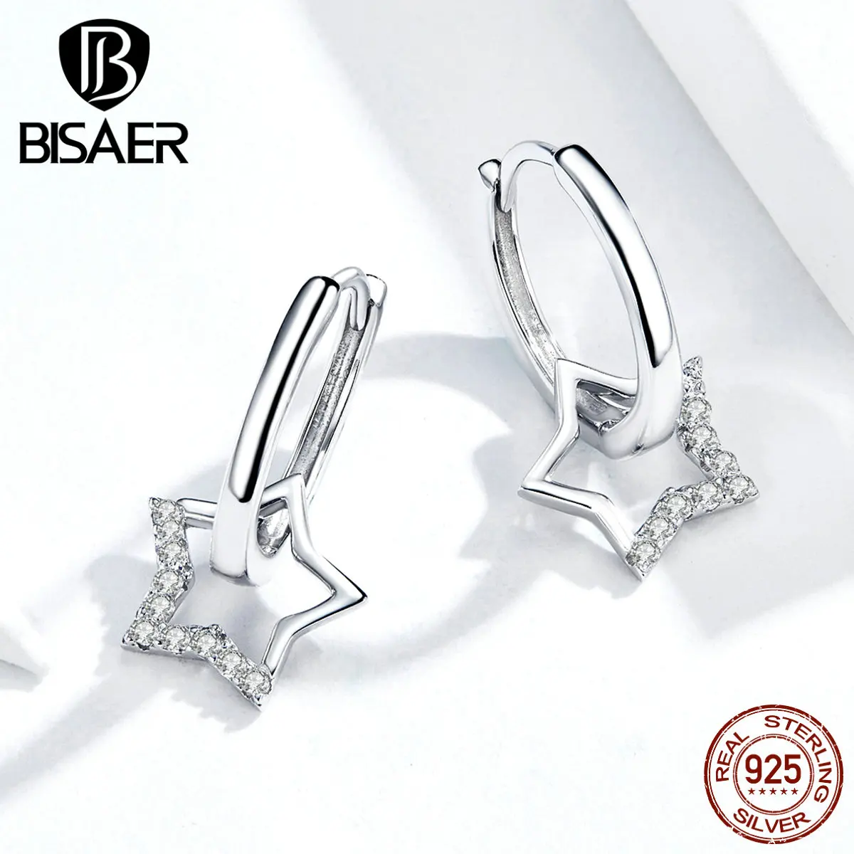 Женские серьги гвоздики в виде звезды серебристые светящиеся с цирконом