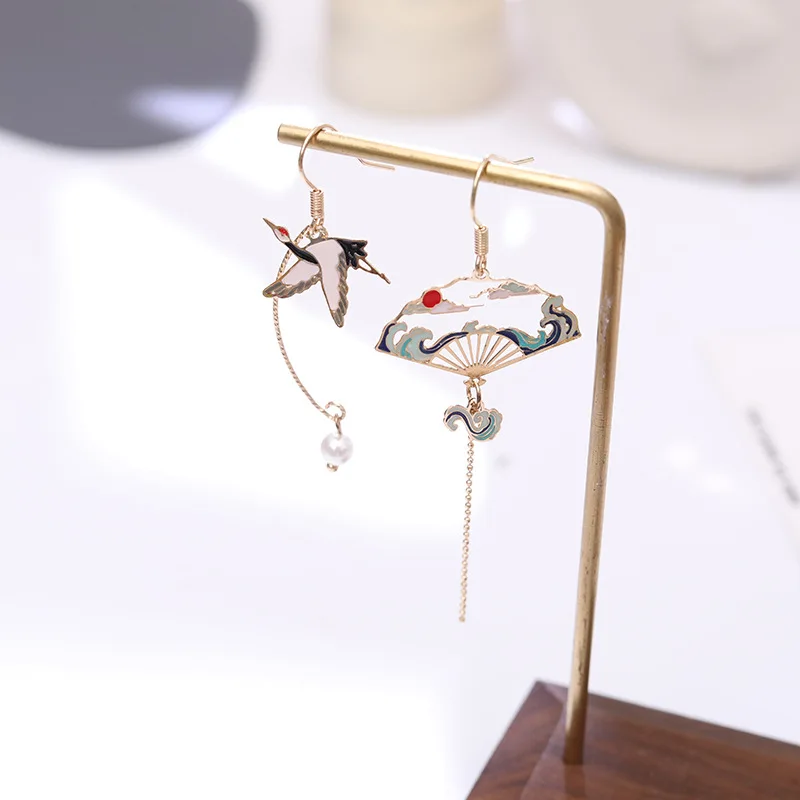 

Creative fashion national style earrings personality asymmetry fan crane spray Earrings elegant hollow Earrings