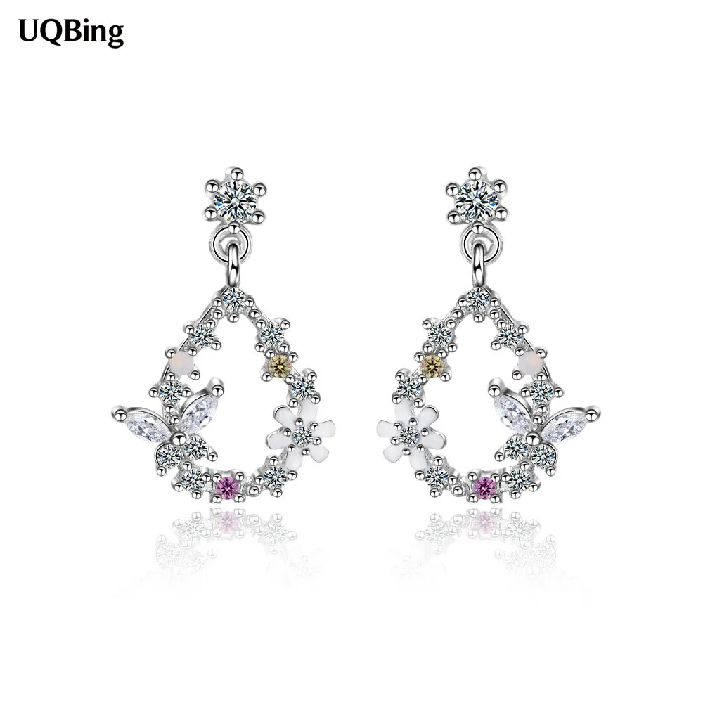 Женские серьги-гвоздики серебряного цвета с цветами и кристаллами