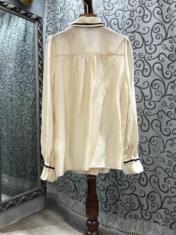 

Autumn / winter 2020 new women's Lapel chest ear edge splicing decoration long sleeve versatile shirt 1109