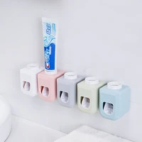 2021 new wall mounted automatic toothpaste dispenser squeezers bathroom accessories toothpaste rack dispensador pasta dientes