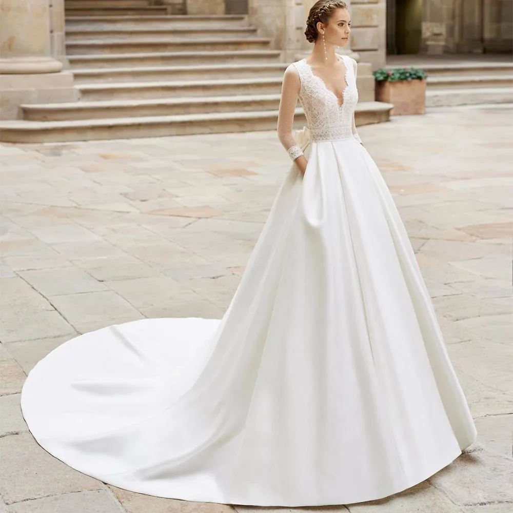 

Платье свадебное кружевное ТРАПЕЦИЕВИДНОЕ с V-образным вырезом, длинными рукавами и карманами