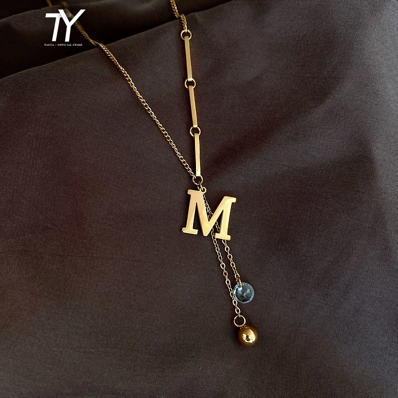 

2020 new design sense M letter tassel titanium steel color fast necklace fashion luxury women's neck chain party sweater chain