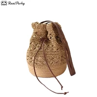 hollow bucket woven shoulder seaside vacation straw bag beach handbags for women 2021