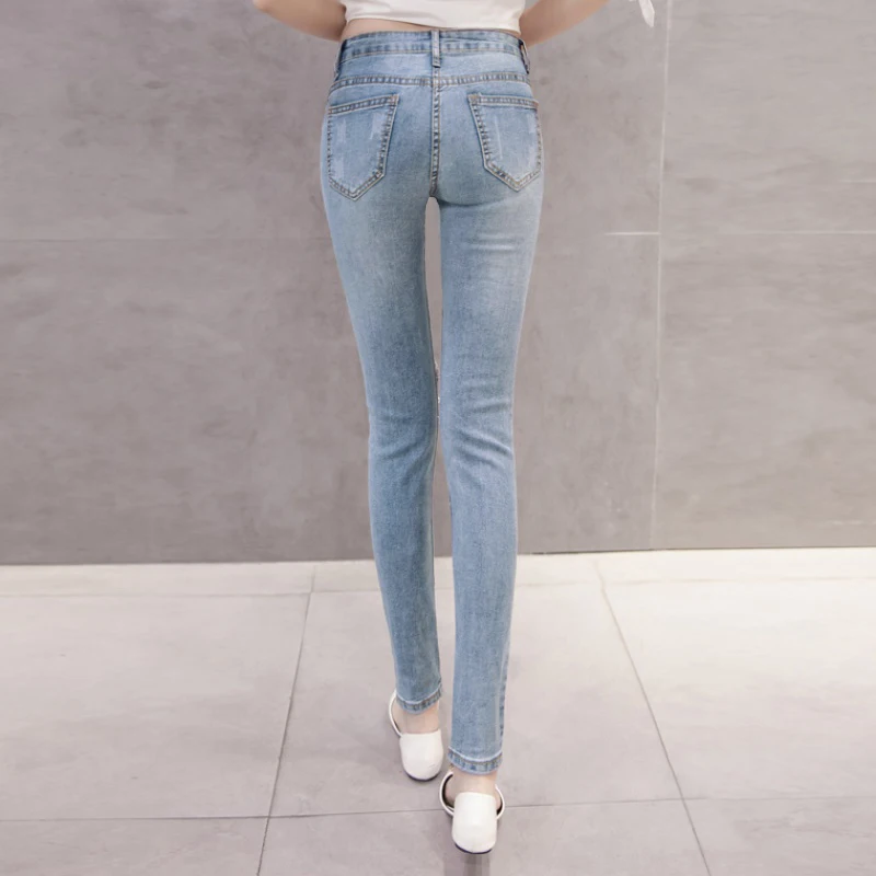 Женские джинсовые брюки с перламутровыми вставками повседневные рваные