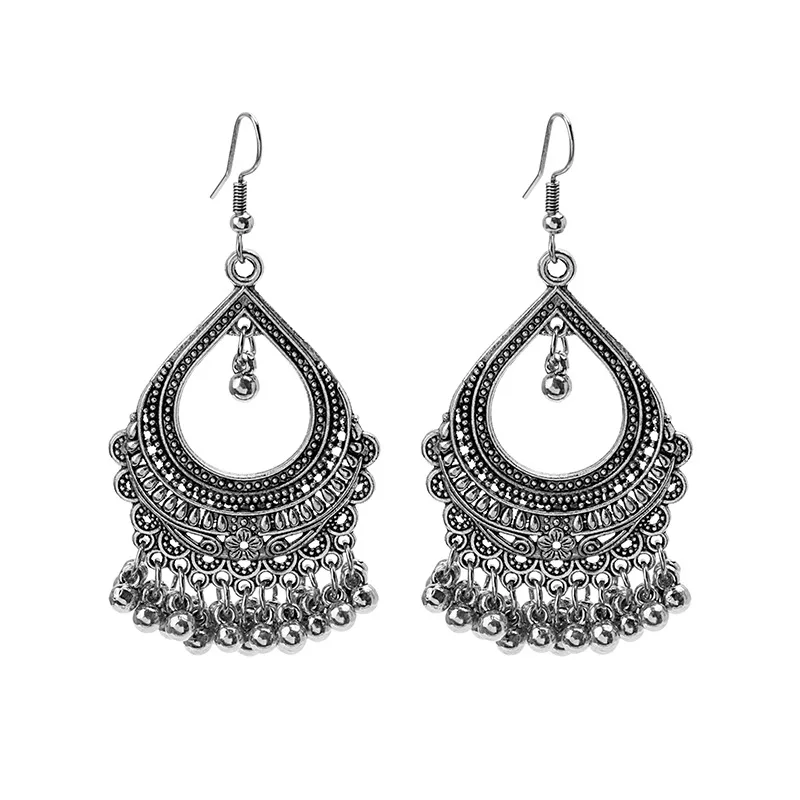 

Europe and the United States metal carved flowers geometric hollow round earrings long bell beads tassel minority jewelry