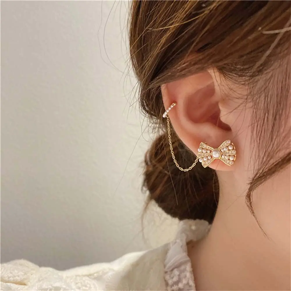 

Модные жемчужные серьги-клипсы с бантом и кисточкой, женские длинные клипсы для ушей, серьги-клипсы с кубическим цирконием, серьги-каффы, юв...