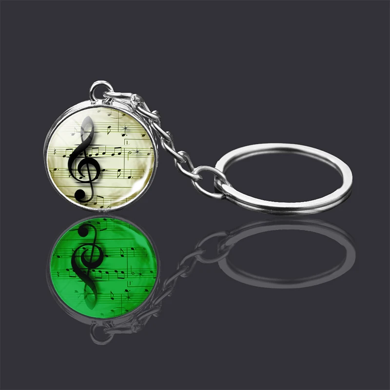 Световой с музыкальными знаками брелок двухсторонний стеклянный шар в виде