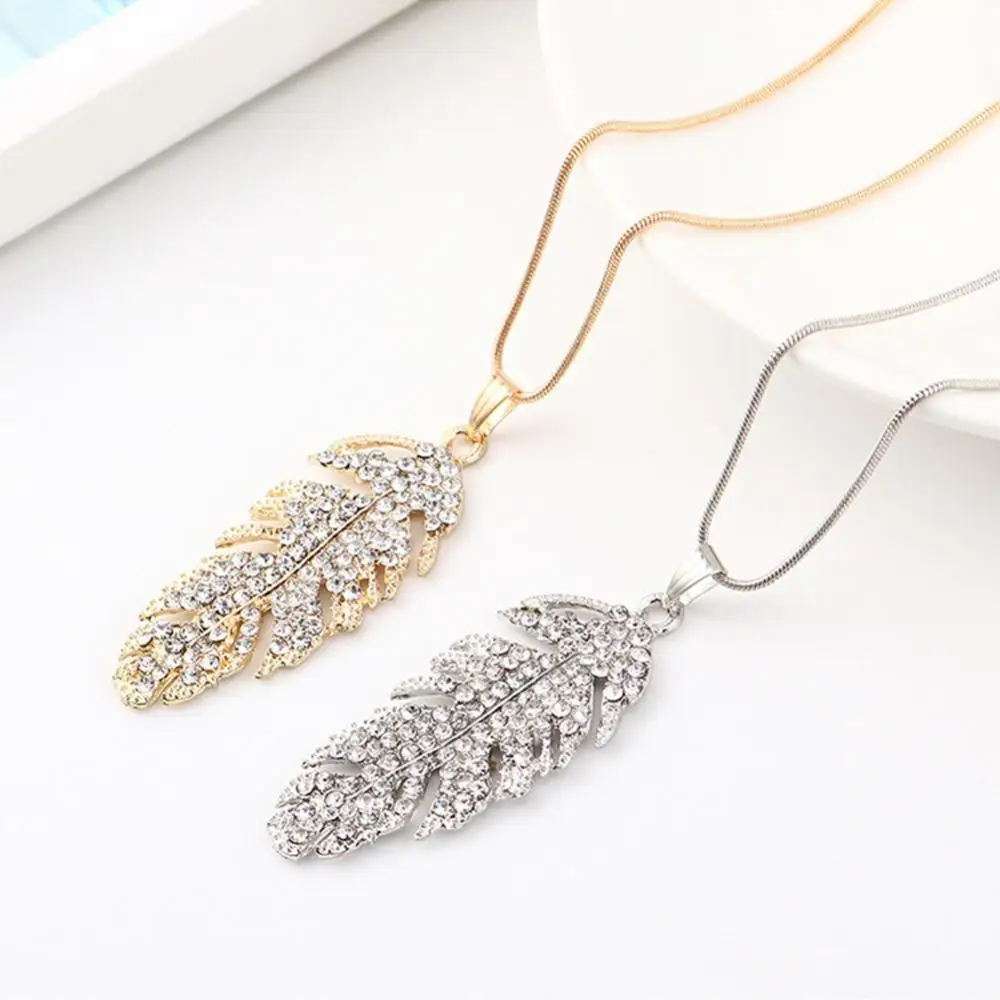 

Women Rhinestone Inlaid Long Leaf Pendant Necklace Hook Earrings Jewelry Set